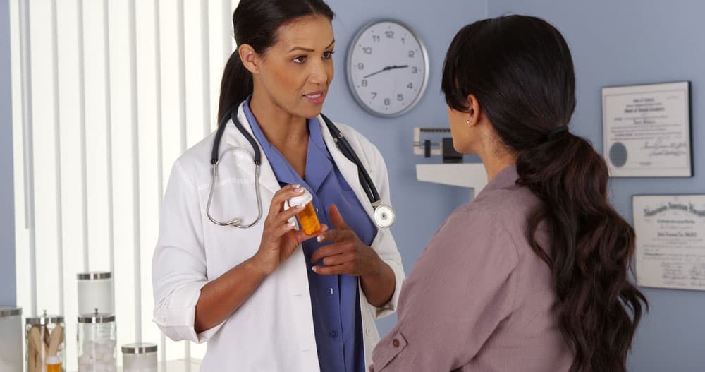 a doctor explaining how a patient's medication works